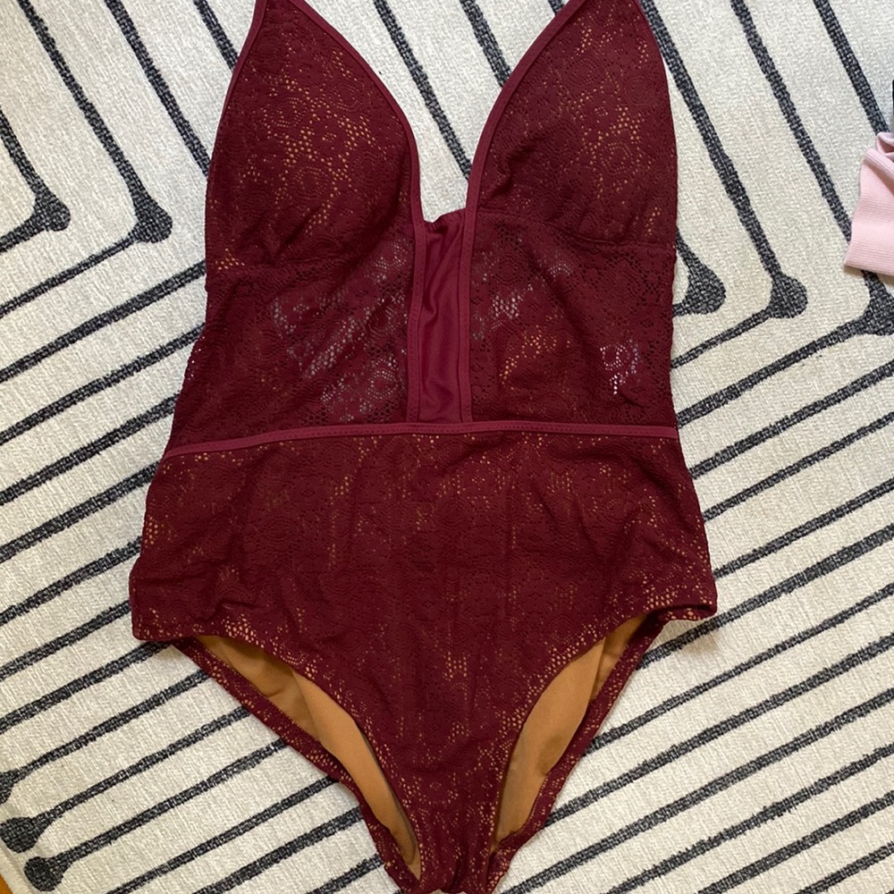 One-piece swimsuit with lace cutout and halter top